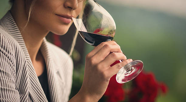 Woman sipping on red wine 