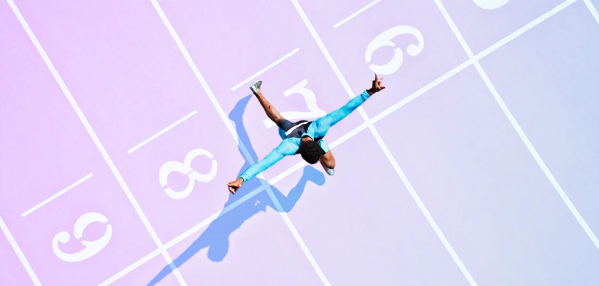 A person running over the finish line of a race