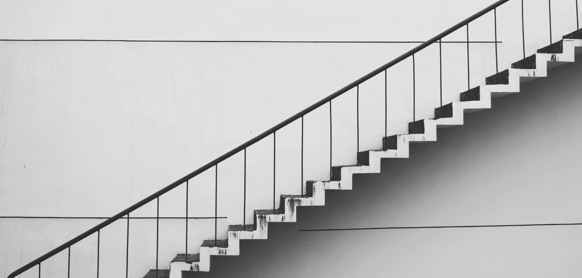 A black and white photograph showcasing a stairway