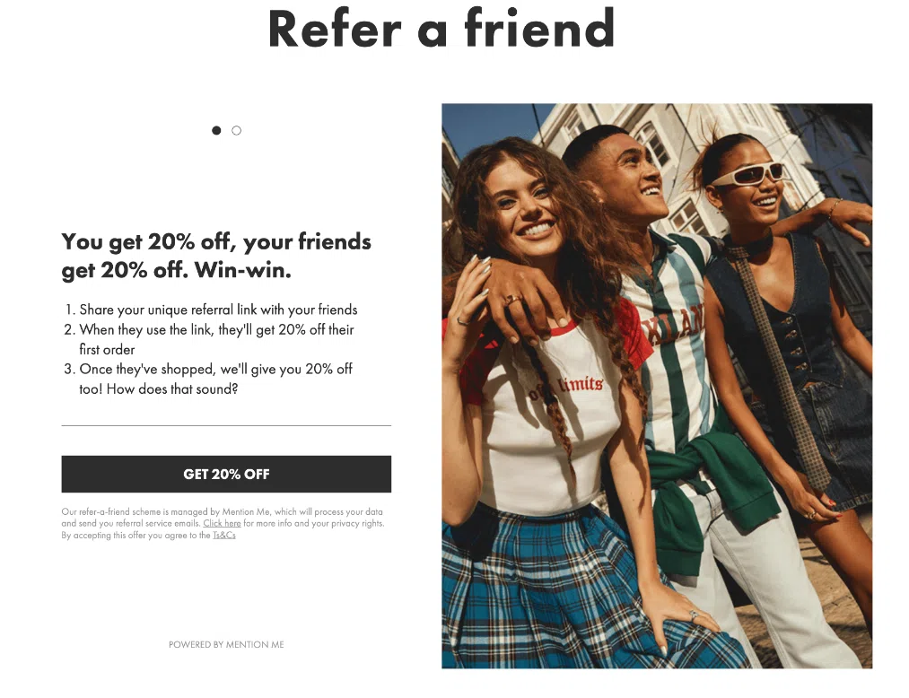 A group of three stylish friends pose together outdoors, showcasing trendy outfits and joyful expressions. Text promoting a referral discount appears nearby.