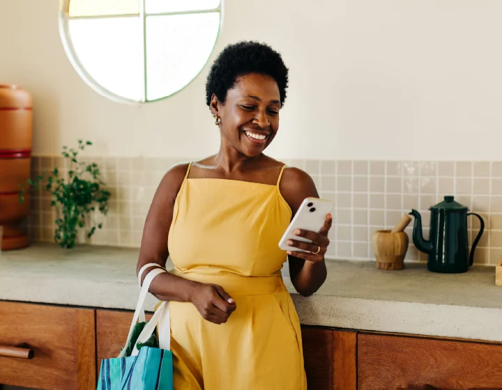 Woman smiling at her phone