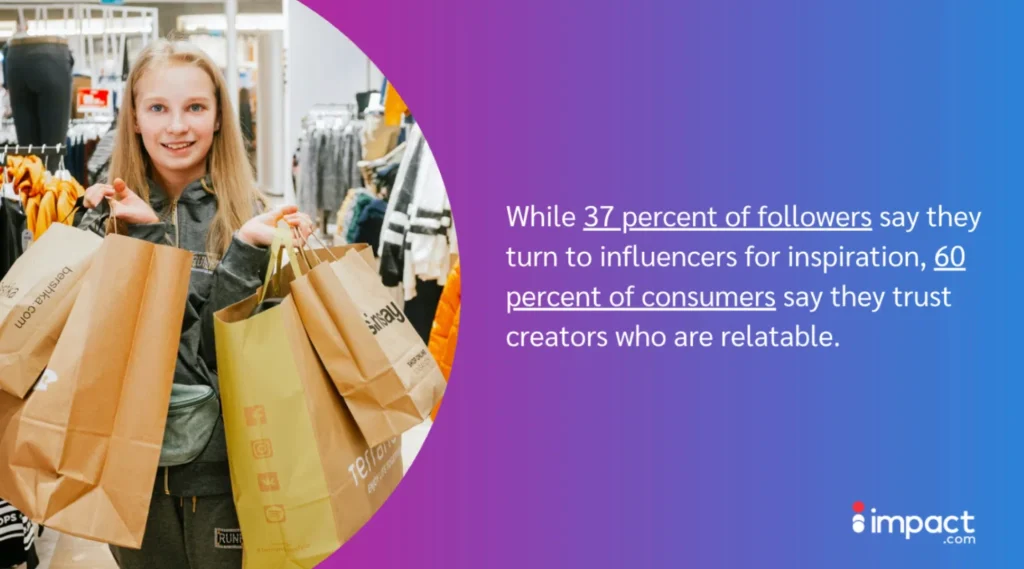 A shopper holds multiple paper bags while browsing a retail store, surrounded by clothing displays in a vibrant and lively atmosphere.