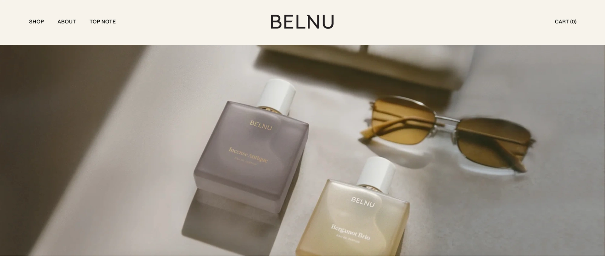 Website design for Benu, showcasing perfume and cosmetics with elegant layout and vibrant visuals.
