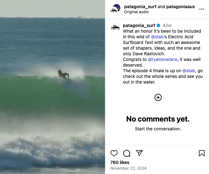 A surfer rides a large green wave, showcasing skill and fluidity in a sunny ocean setting.