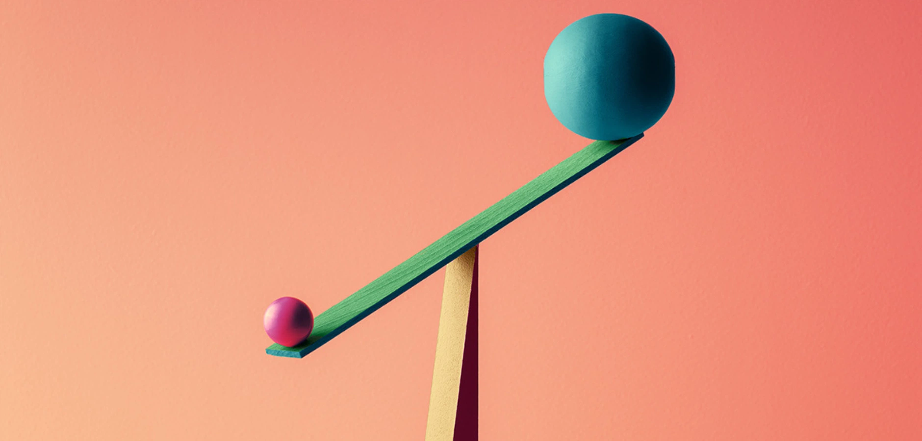 A wooden stick holds a colorful ball and a pink egg, showcasing a playful and whimsical design.