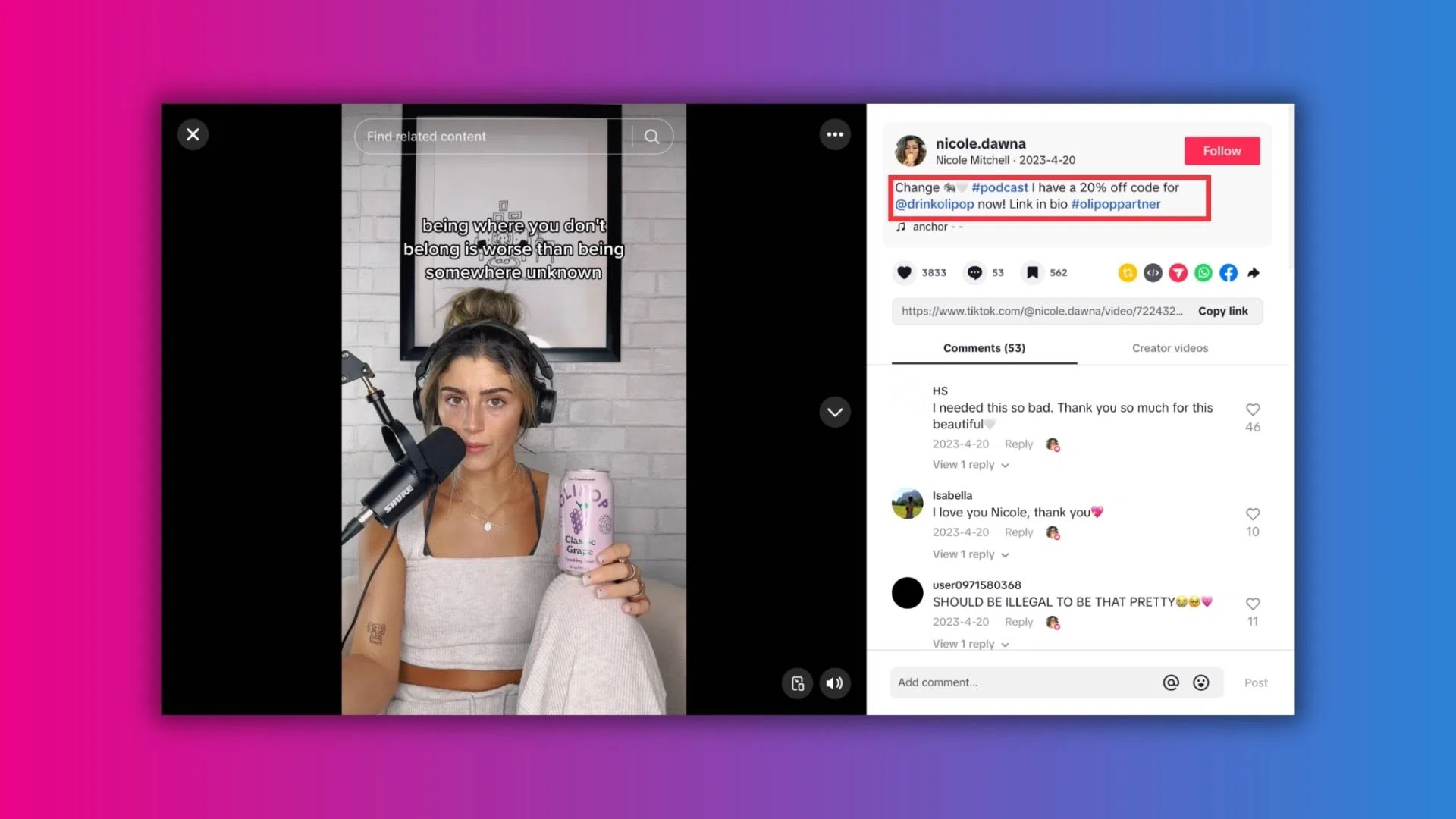 A woman smiles while holding a drink in front of a camera, capturing a moment of joy and celebration.