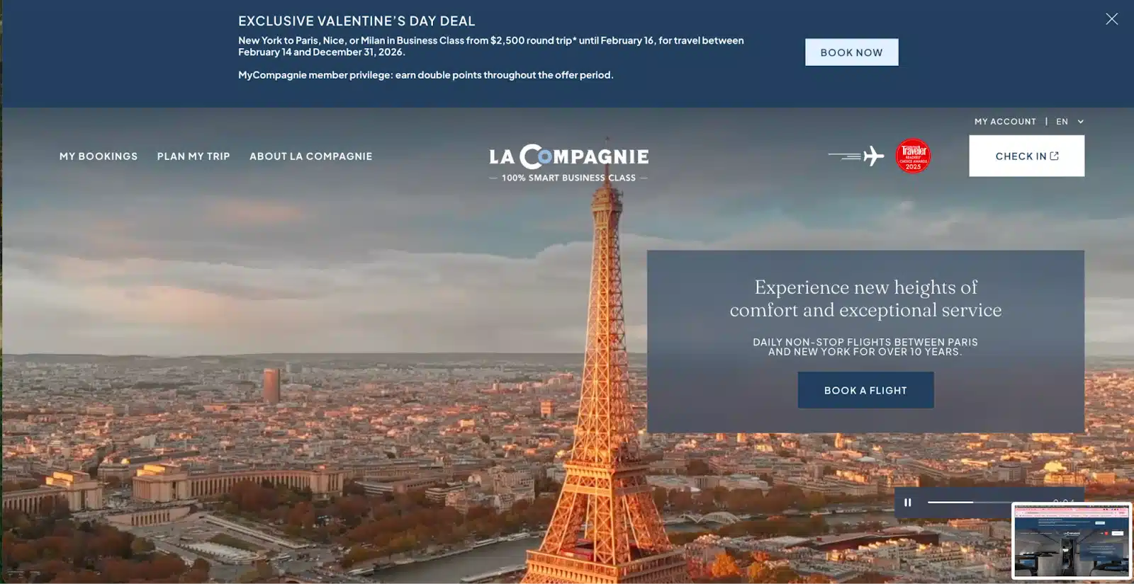Aerial view of Paris featuring the Eiffel Tower at sunset, promoting La Compagnie’s Valentine’s Day flight deal.