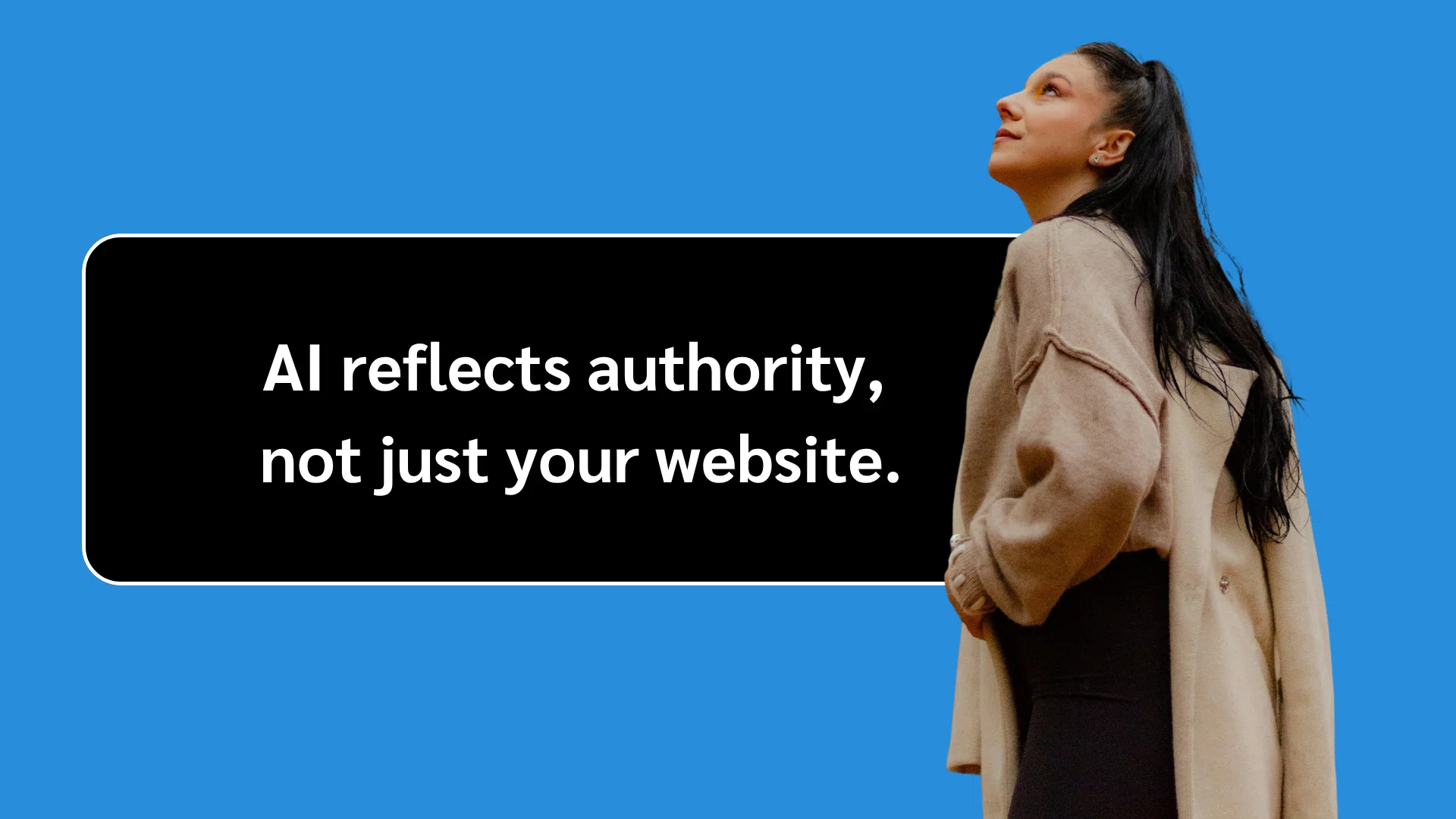 Woman in beige sweater and black pants beside a black text box on blue background that reads "AI reflects authority, not just your website."