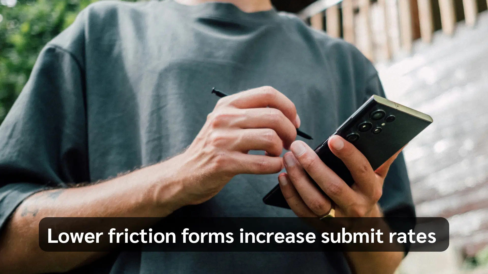 Person holding a smartphone and stylus, with text overlay: “Lower friction forms increase submit rates.”