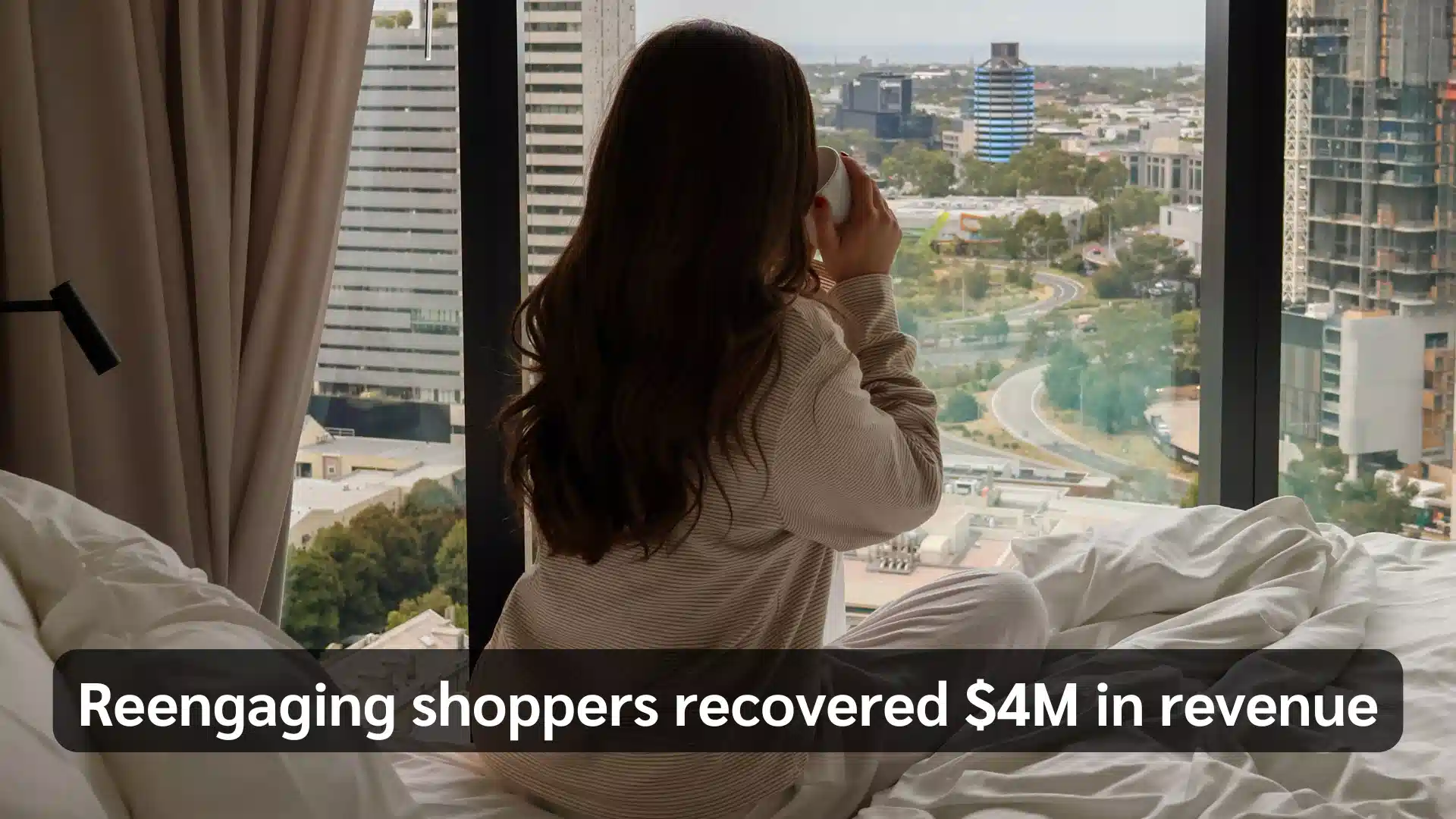 Woman drinking coffee by a hotel window overlooking a city; text reads, “Reengaging shoppers recovered $4M in revenue.”